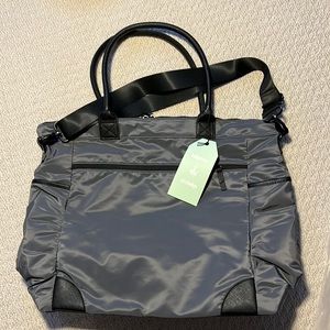 Indigo diaper bag, brand new, has cross body strap and over the shoulder straps
